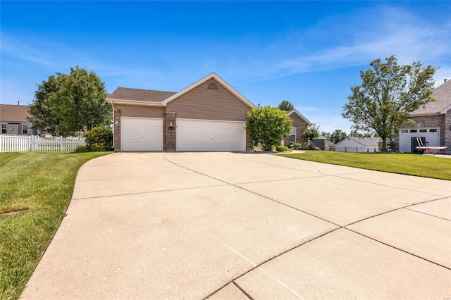 view of front of property with a garage and a front lawn