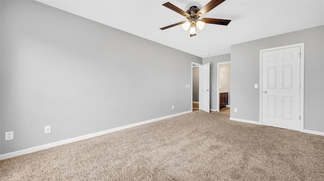 unfurnished bedroom with connected bathroom, ceiling fan, and carpet floors