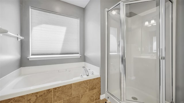 bathroom featuring plus walk in shower