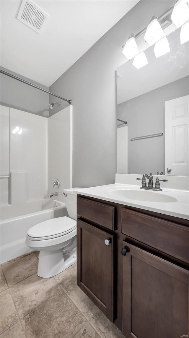 full bathroom featuring shower / bathing tub combination, vanity, and toilet