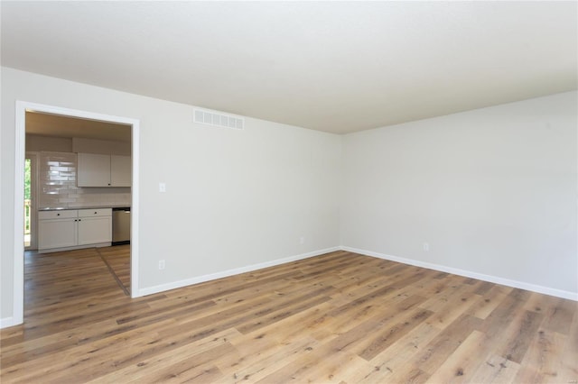 spare room featuring light wood-type flooring