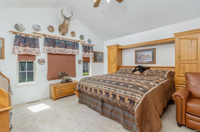 carpeted bedroom featuring ceiling fan and vaulted ceiling