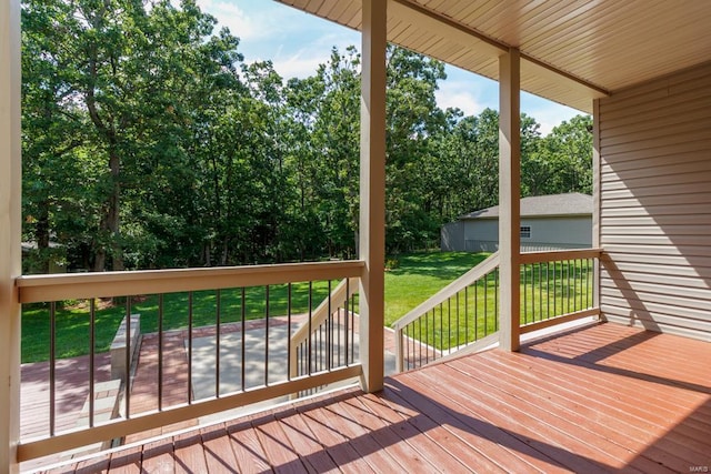 deck featuring a lawn