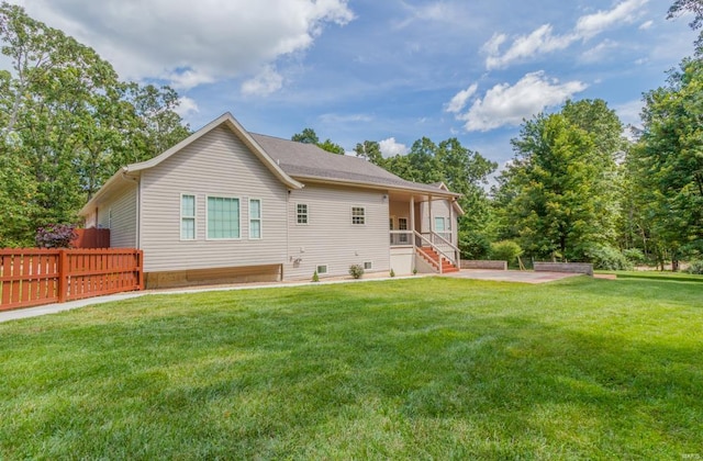 back of house with a yard