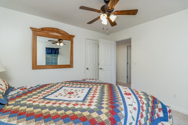 bedroom with a closet, ceiling fan, and carpet flooring