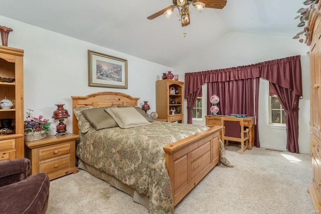 carpeted bedroom featuring ceiling fan and lofted ceiling