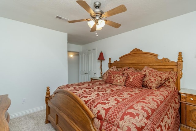 bedroom with light colored carpet, a closet, and ceiling fan