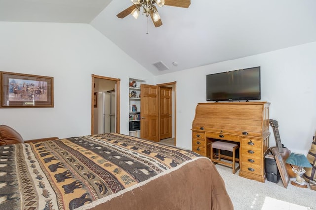 bedroom featuring vaulted ceiling, light colored carpet, and ceiling fan