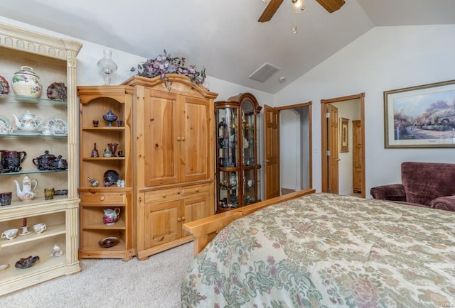 bedroom with vaulted ceiling, ceiling fan, and carpet