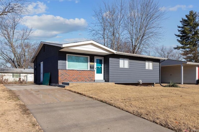 ranch-style house with a carport and a front yard