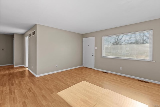 empty room with wood-type flooring