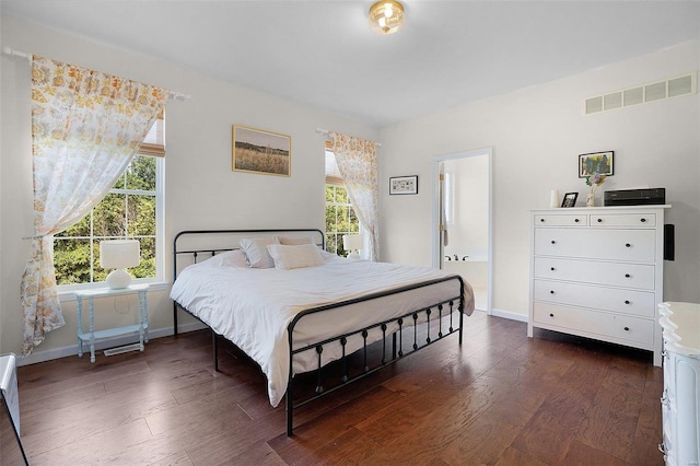 bedroom featuring dark hardwood / wood-style floors