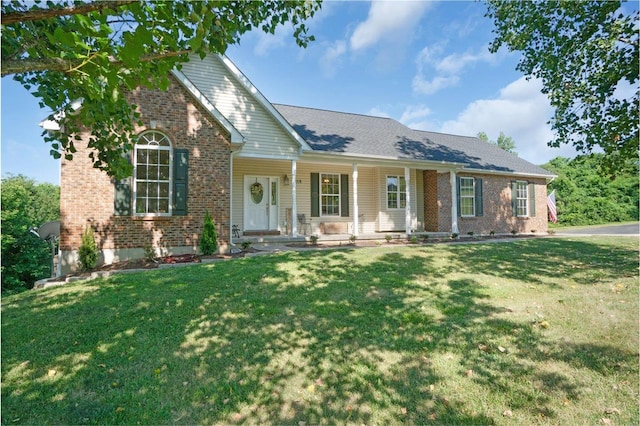 view of front of house featuring covered porch and a front lawn