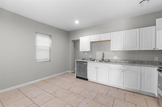 kitchen with white cabinetry, light stone counters, appliances with stainless steel finishes, and sink