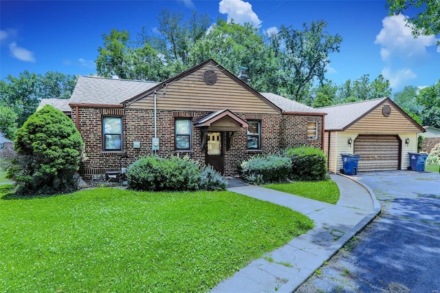 view of front facade featuring a garage and a front lawn