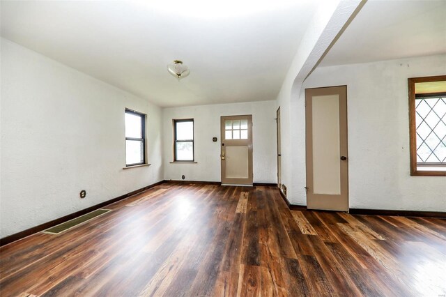 foyer entrance featuring dark hardwood / wood-style floors