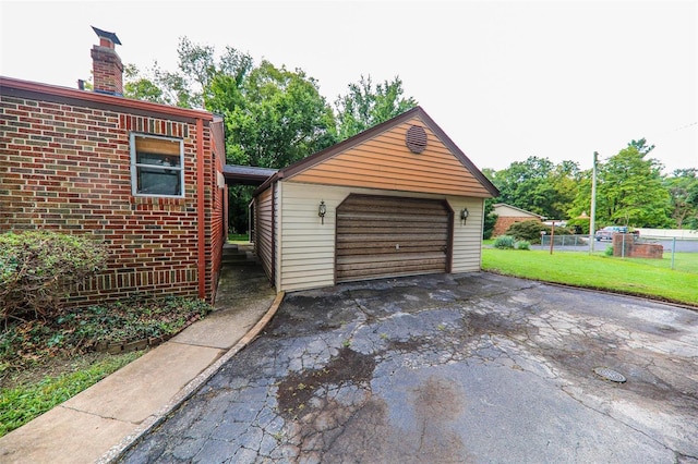 garage featuring a lawn