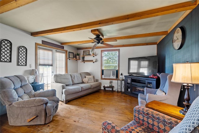 living room featuring beam ceiling, ceiling fan, light hardwood / wood-style flooring, and cooling unit