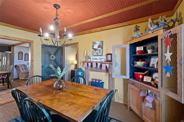 dining area with wood ceiling and a notable chandelier