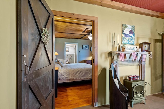 bedroom with hardwood / wood-style floors and wood ceiling