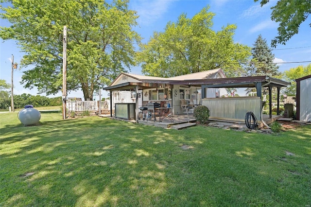 back of property featuring a lawn