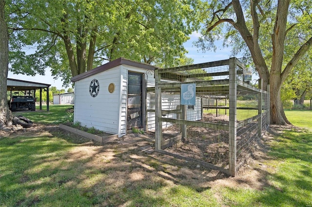 view of outdoor structure with a lawn