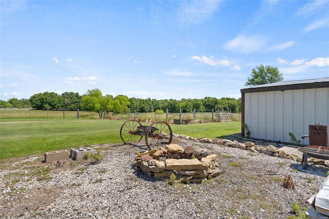 view of yard with a rural view