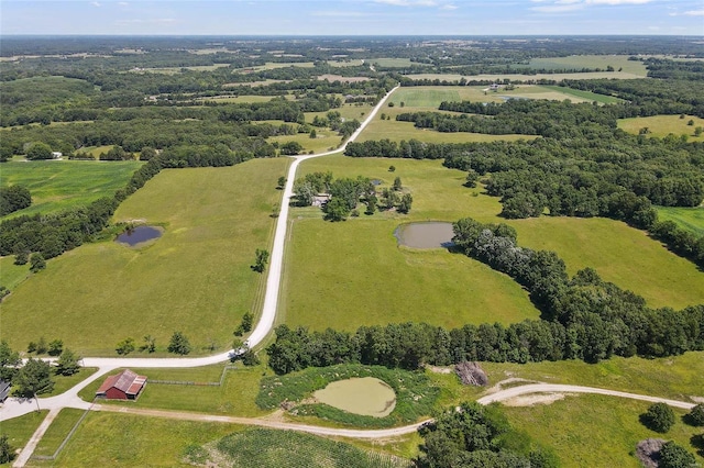 birds eye view of property with a rural view