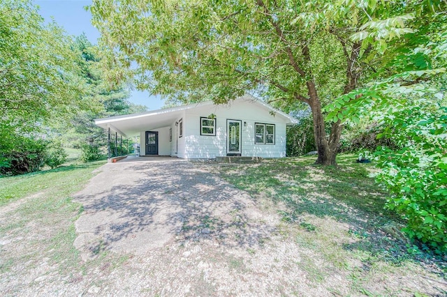 single story home with a carport