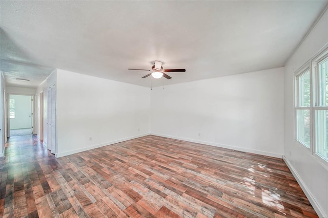 unfurnished room with ceiling fan and wood-type flooring