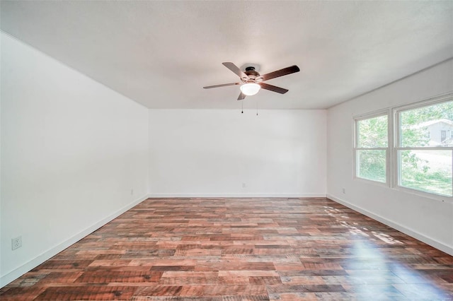 unfurnished room with hardwood / wood-style floors and ceiling fan