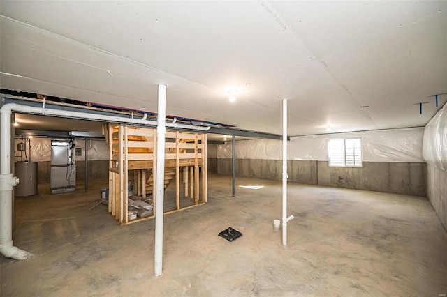 basement with heating unit and water heater