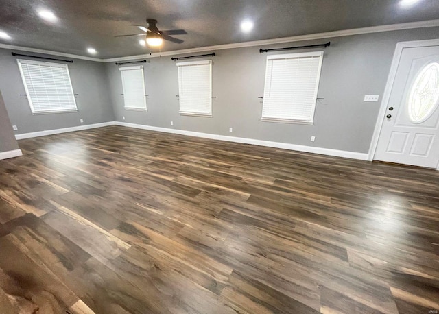 foyer featuring ceiling fan, dark hardwood / wood-style floors, and crown molding