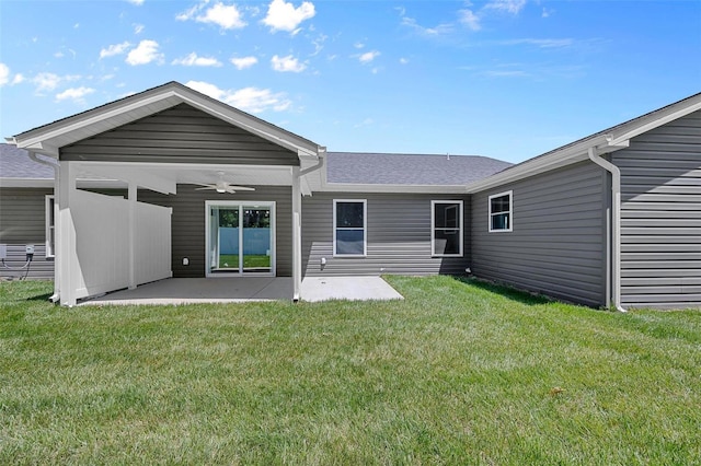 back of house with a yard, a patio area, and ceiling fan