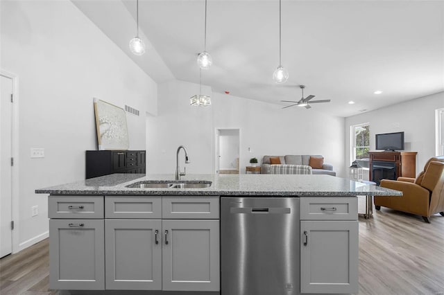 kitchen with pendant lighting, dishwasher, sink, and gray cabinetry