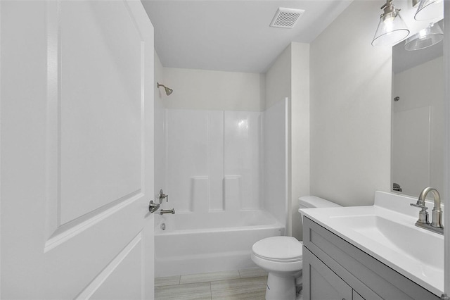 full bathroom with vanity,  shower combination, and toilet