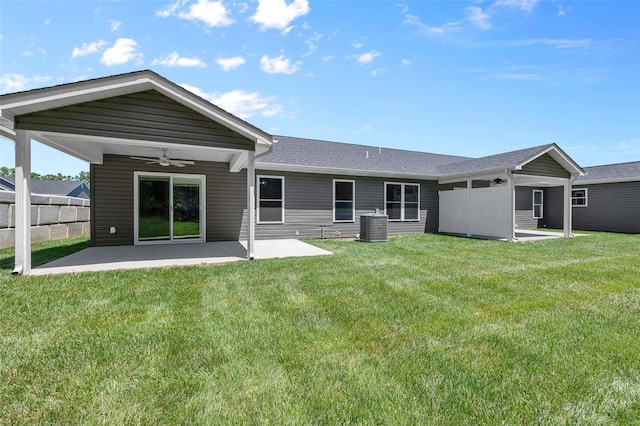 back of property featuring a lawn, central AC, ceiling fan, and a patio area