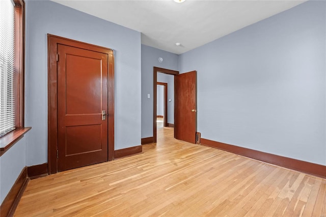 unfurnished bedroom with light hardwood / wood-style floors