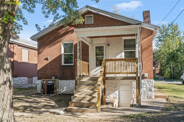 rear view of house with a garage