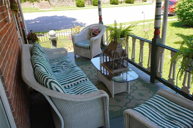 balcony featuring a porch