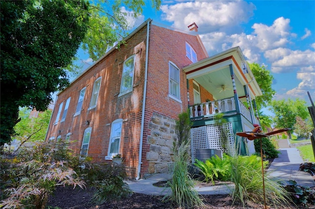 view of property exterior with a porch