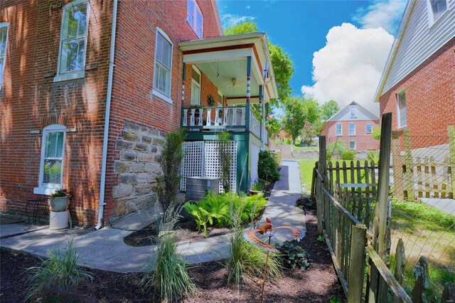 view of side of property with a porch