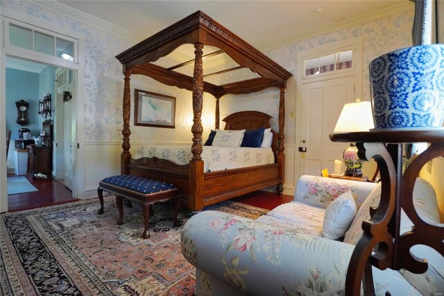 bedroom with wood-type flooring and ornamental molding