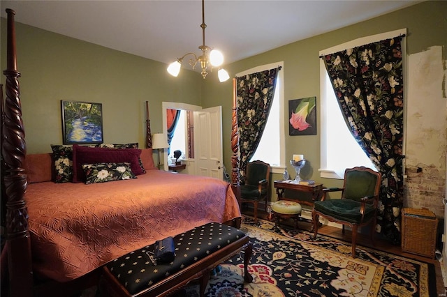 bedroom featuring a notable chandelier