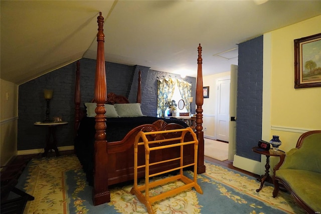 bedroom featuring vaulted ceiling