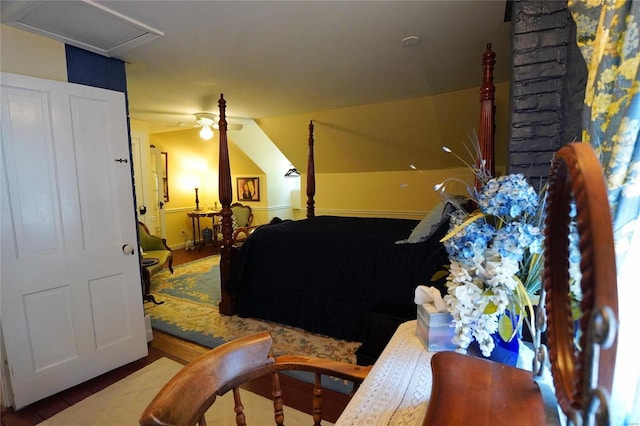 bedroom with lofted ceiling and hardwood / wood-style flooring