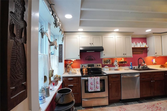 kitchen featuring sink, light tile patterned floors, and stainless steel appliances