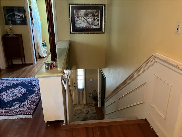 stairs featuring hardwood / wood-style flooring