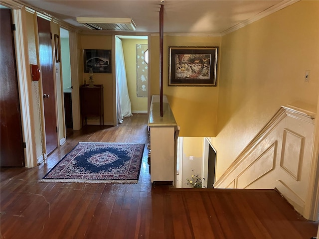 hall featuring wood-type flooring and ornamental molding