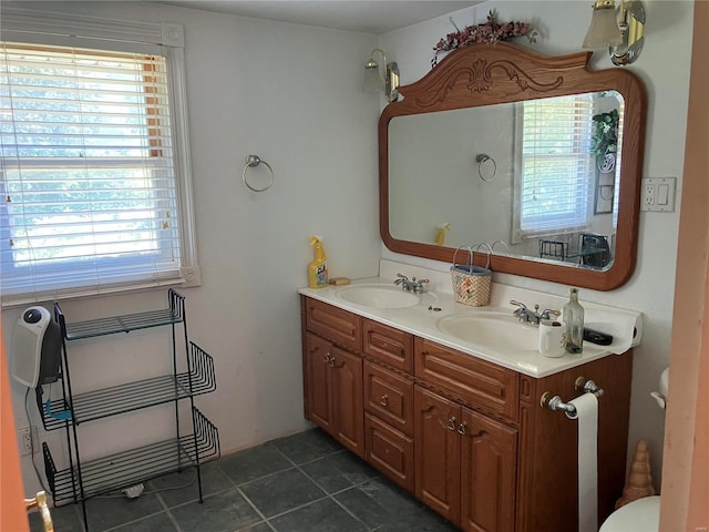 bathroom featuring toilet and vanity